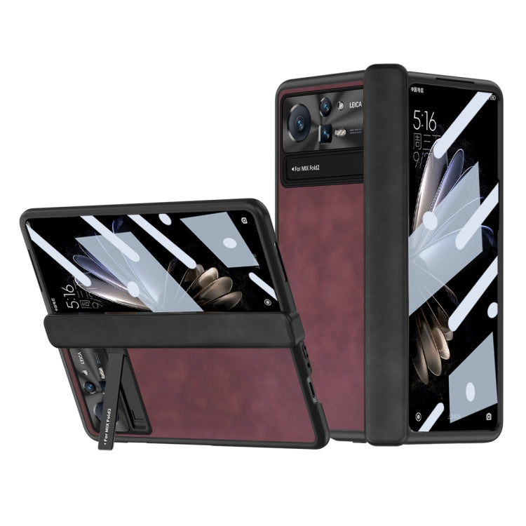Folding phone case with textured cover and camera cutouts, red-brown color for foldable phones.