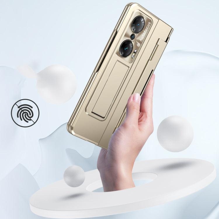 Champagne gold folding phone case held in hand; hinge and camera cutouts