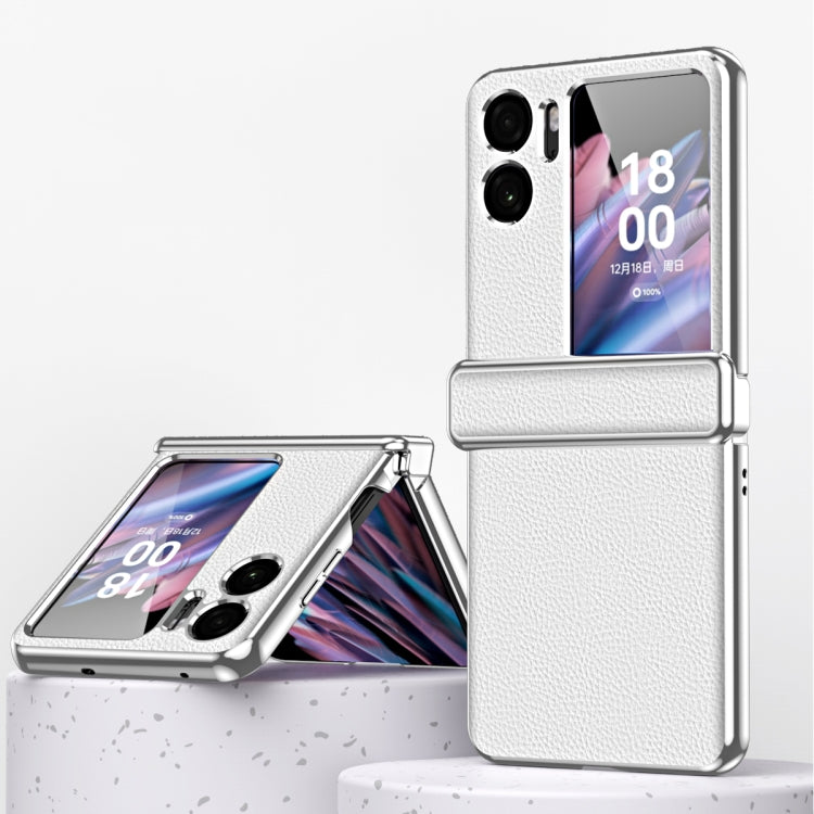 White magnetic flip phone case with textured litchi pattern and metal frame edge