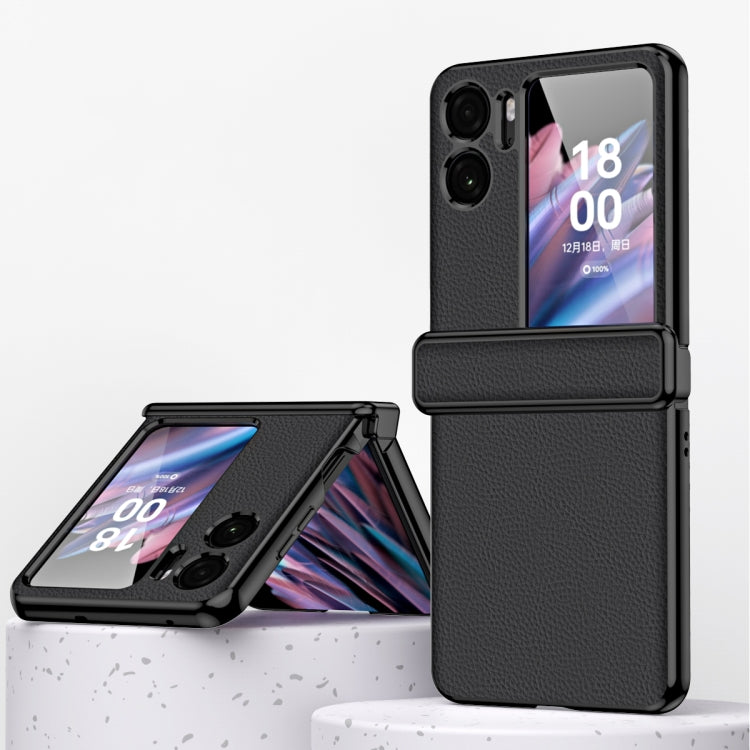Black magnetic flip phone case with textured litchi pattern and metal frame edge
