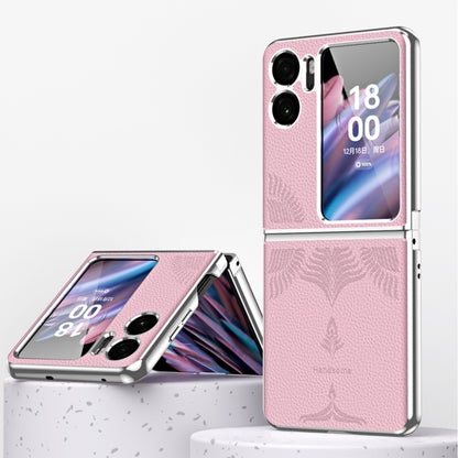 Pink electroplated fold phone case with embossed leaf pattern and camera cutouts.