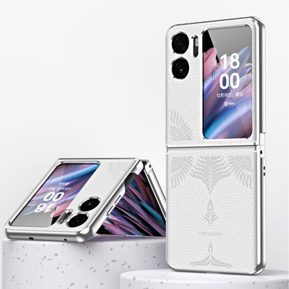 White fold phone case with electroplated frame, embossed leaf pattern, and camera cutouts.