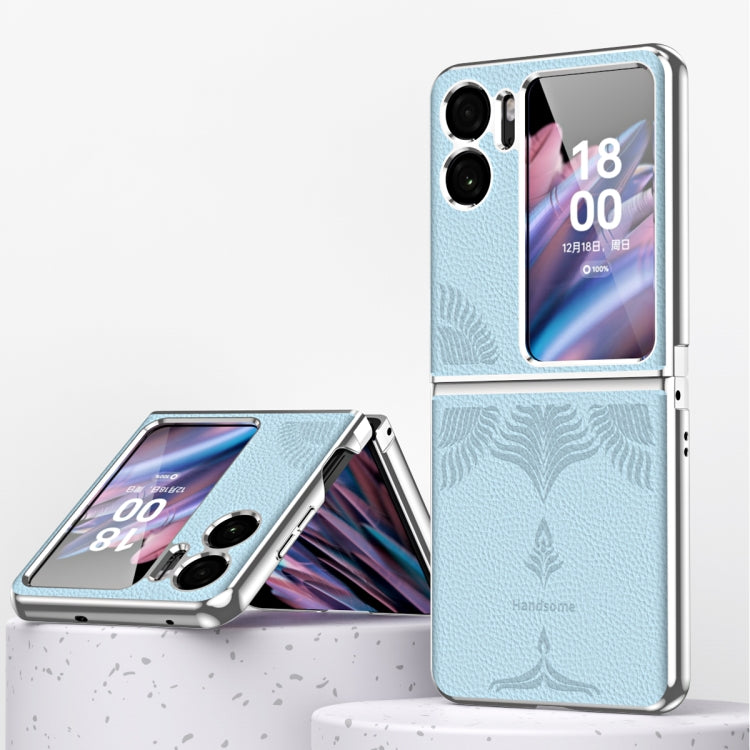 Blue fold phone case with electroplated edges and embossed leaf pattern on the back.