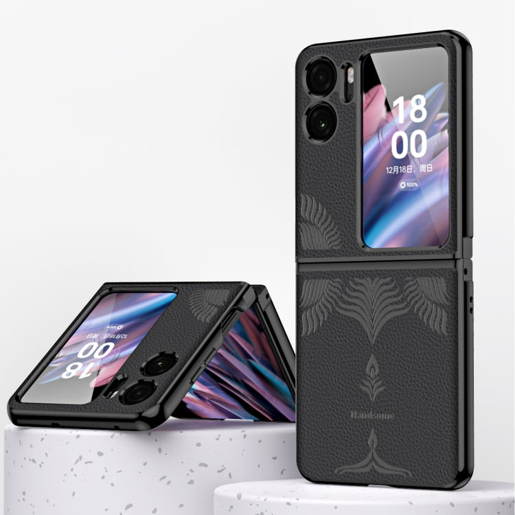 Black fold phone case with embossed leaf pattern and electroplated metal-look frame.