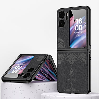 Black fold phone case with embossed leaf pattern and electroplated metal-look frame.