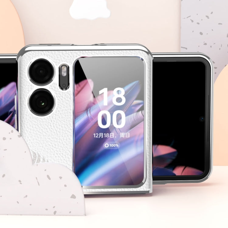 White fold phone case with embossed leaf texture, electroplated corners, and camera openings.