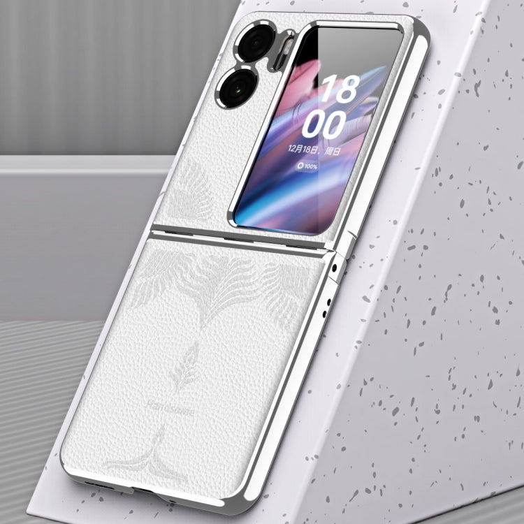 White fold phone case with embossed leaf pattern and electroplated side frame details.