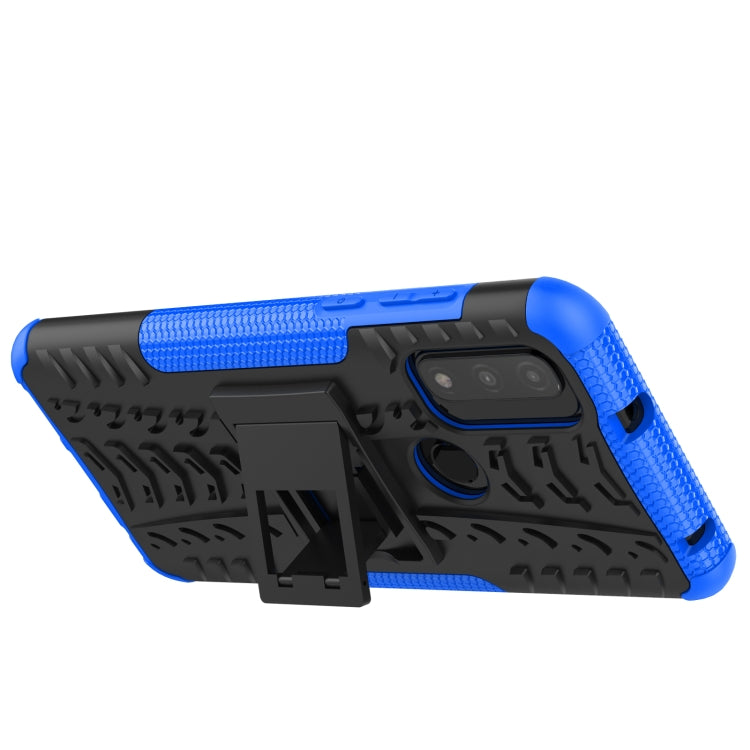 Blue and black rugged phone case with tire-tread texture and kickstand holder