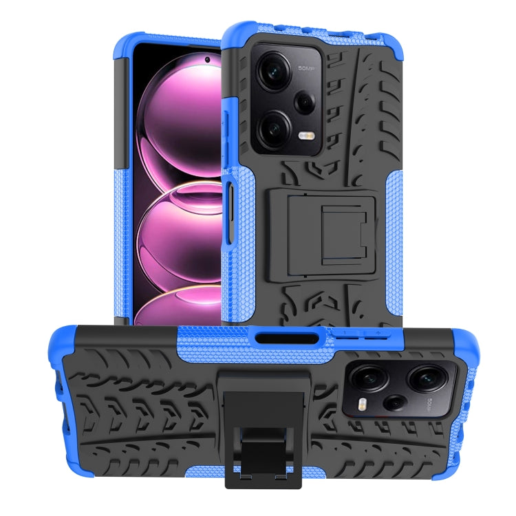 Blue rugged phone case with tire-tread texture and built-in holder/stand