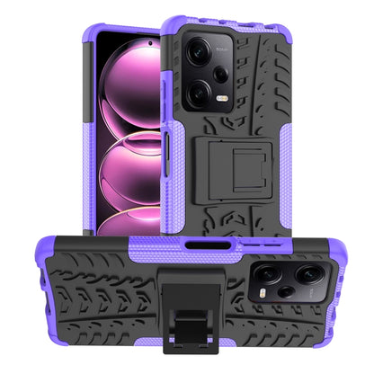 Purple rugged phone case with tire-tread texture and built-in holder/stand