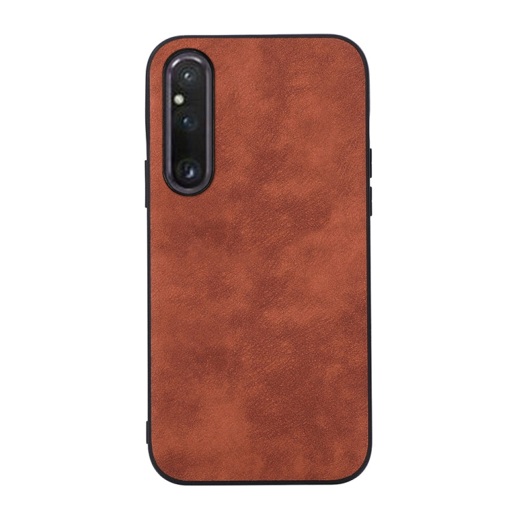 Brown PU phone case with Morocco-style textured finish and dual camera cutout.