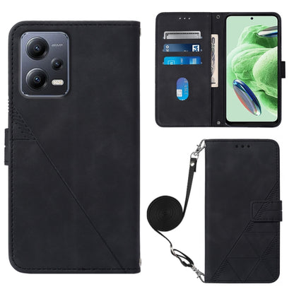 Black leather flip phone case with crossbody strap and geometric embossed front