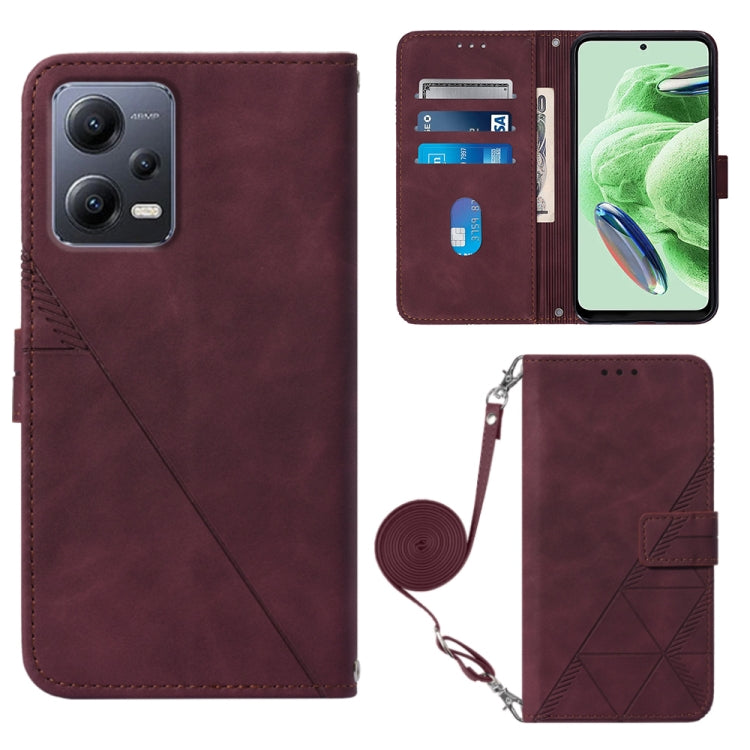 Crossbody flip leather phone case, burgundy with embossed geometric pattern and strap