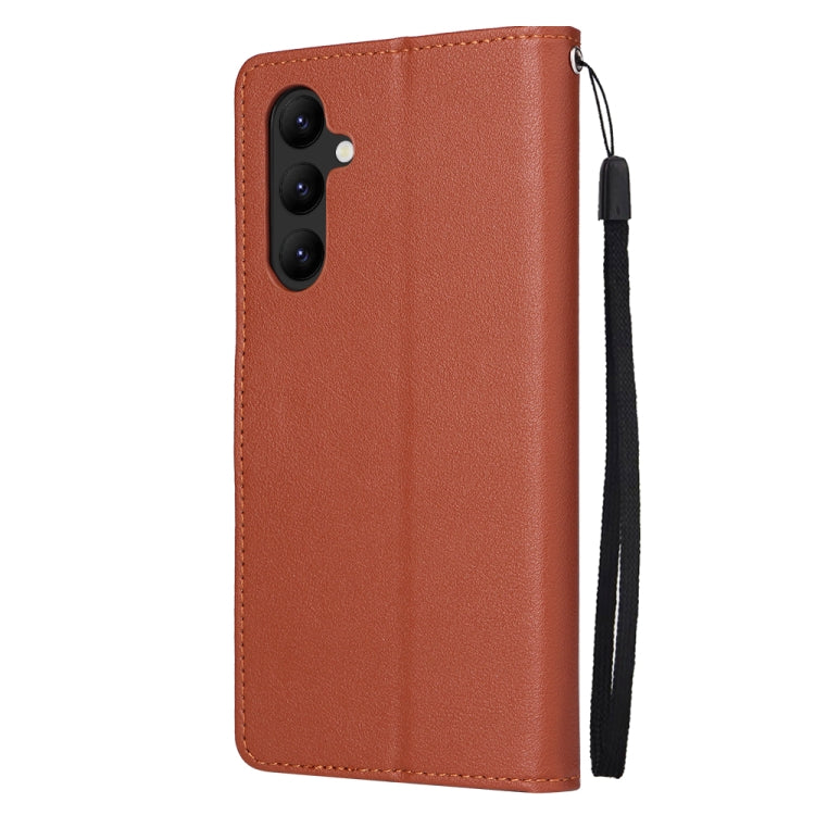Brown leather phone wallet case with stitched edges and wrist strap