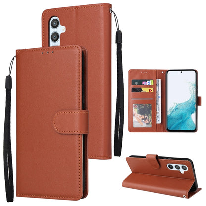 Brown leather wallet phone case with 3 card slots and wrist strap