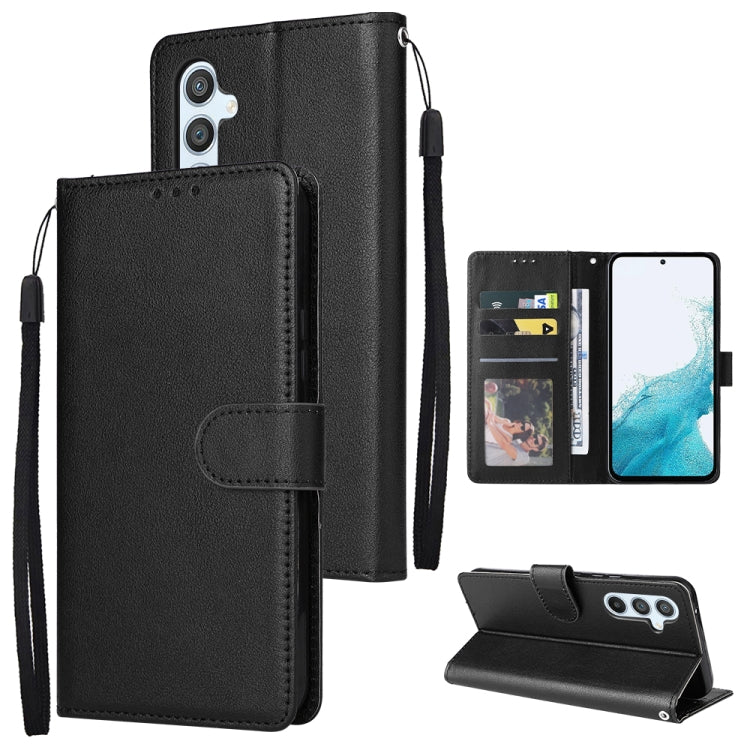 Black leather phone wallet case with card slots, folio cover, and wrist strap