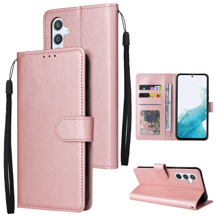 Rose pink leather-style phone wallet case with 3 card slots and fold-out kickstand, wrist strap