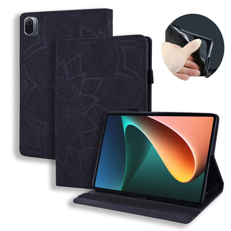 Black embossed leather tablet flip case with built-in stand and magnetic closure.