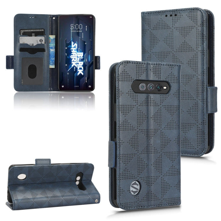 Blue leather folio phone case with symmetrical triangle pattern, camera cutout, side strap