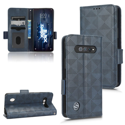 Blue leather folio phone case with symmetrical triangle pattern, camera cutout, side strap