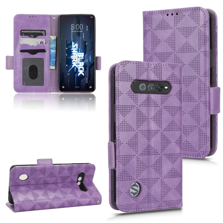 Purple leather wallet-style phone case with magnetic flap and card slots, geometric pattern.