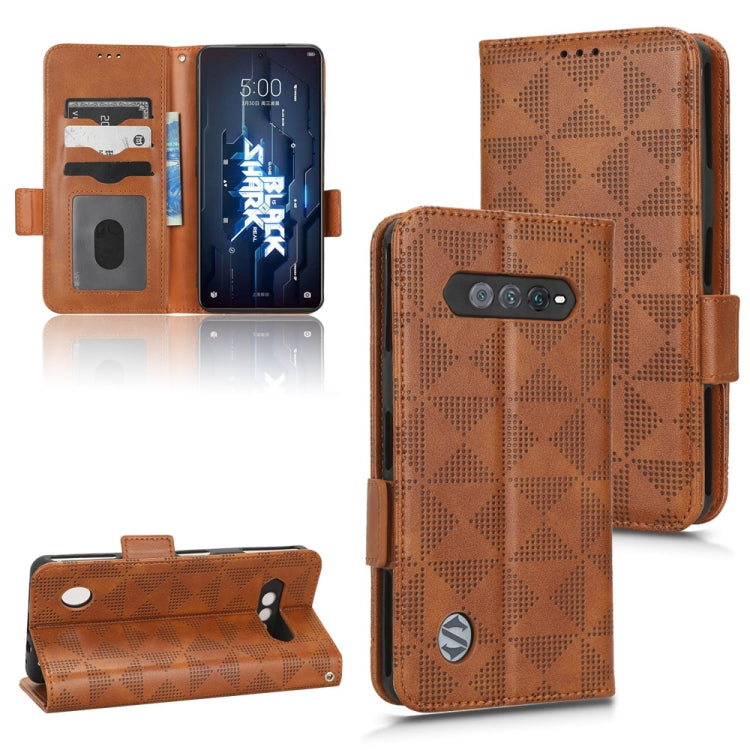 Brown geometric wallet phone case with card slots, belt-style strap, and camera cutout.