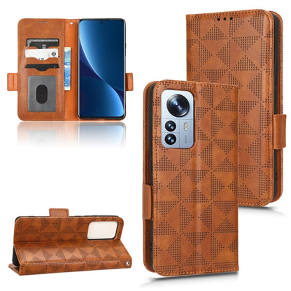 Brown geometric-pattern wallet phone case with card holders and magnetic closure strap.