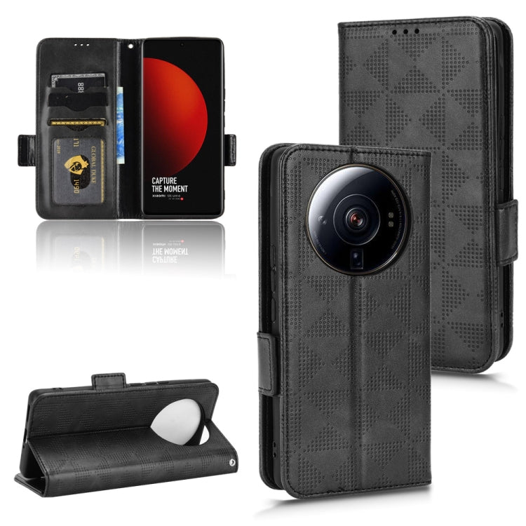 Black leather folio phone case with textured triangle pattern, visible camera opening, and side strap.
