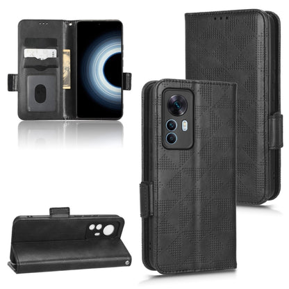 Black leather folio phone case with symmetrical triangle pattern, magnetic strap, card slots