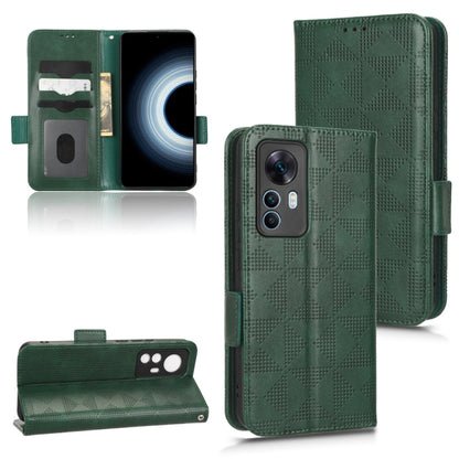 Green leather folio phone case with symmetrical triangle pattern and kickstand, magnetic strap