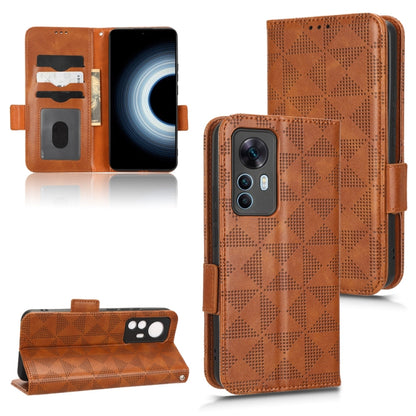 Brown leather folio phone case with symmetrical triangle pattern and kickstand, magnetic strap
