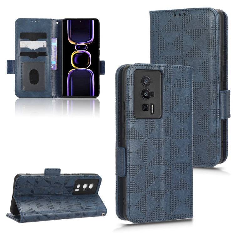 Blue leather folio phone case with symmetrical triangle pattern and side strap