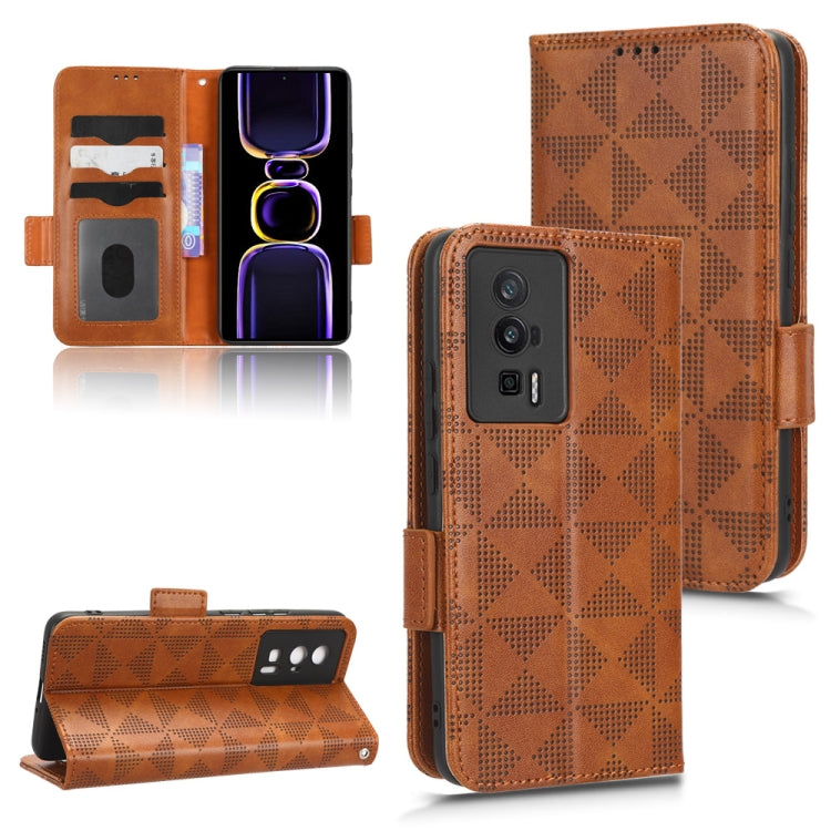 Brown leather folio phone case with symmetrical triangle pattern and side strap