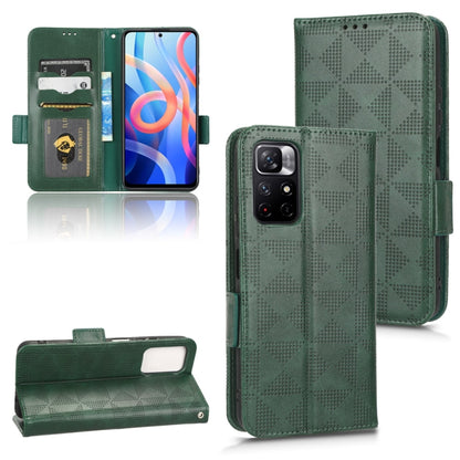 Green leather phone case with geometric triangle texture, wrist flap, and camera cutout