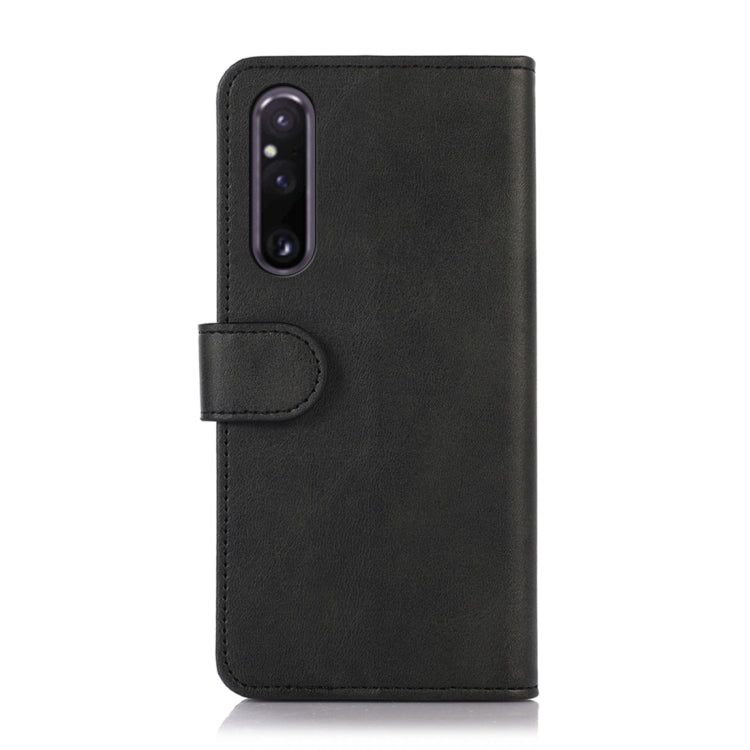 Black flip leather phone wallet case with camera cutout and clasp tab