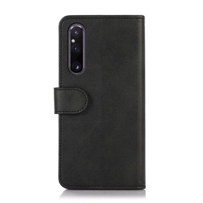 Black flip leather phone wallet case with camera cutout and clasp tab