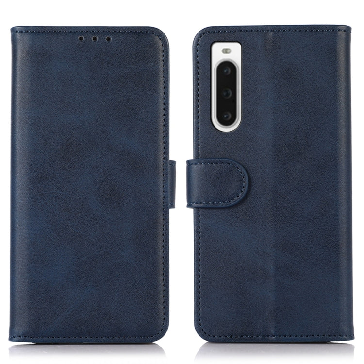Blue flip leather phone wallet case with rear camera cutout and clasp tab