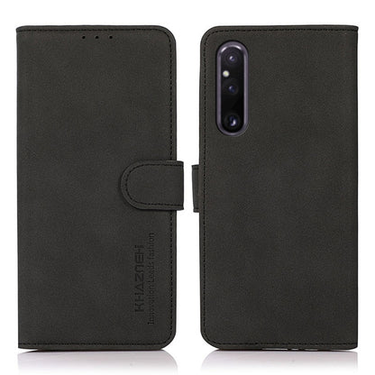 Matte texture leather phone case with folio flap and magnetic strap, black finish.