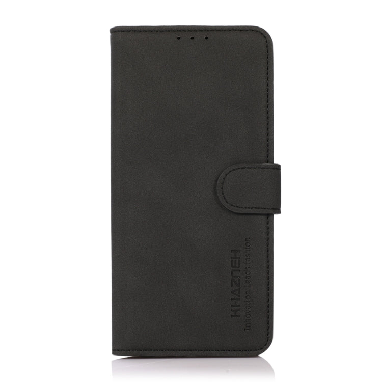 Black matte leather folio phone case with magnetic strap, front cover closed.