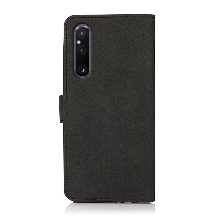 Black matte texture leather phone case with camera cutout, side view.