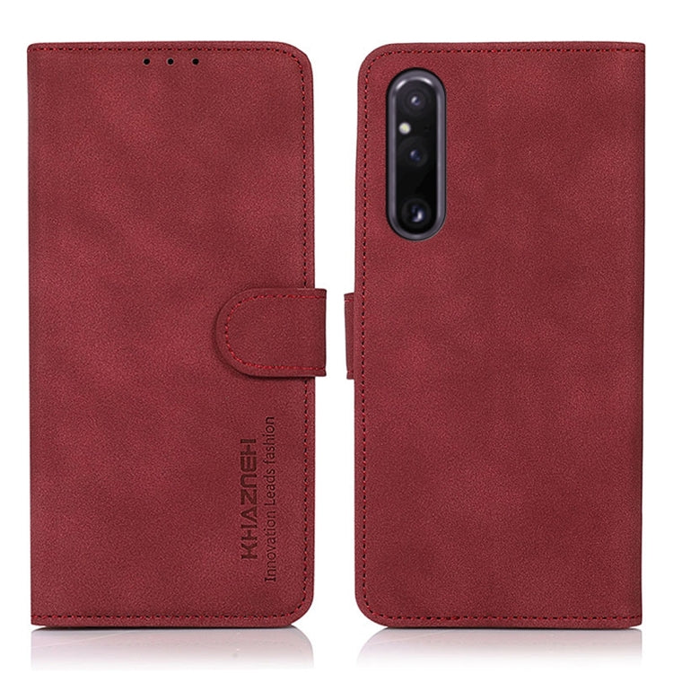 Red matte texture leather phone case with folio flap and magnetic strap, two views.
