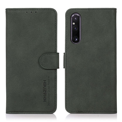 Matte green leather phone case with flip cover and holder strap; camera cutout.