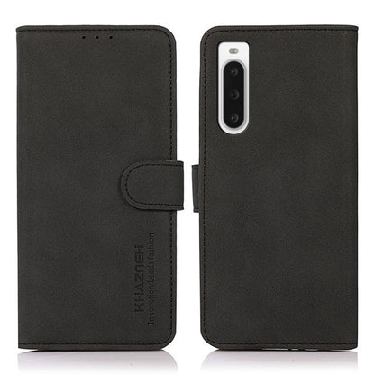 Black matte texture leather phone case front and back, with folio flap and strap.
