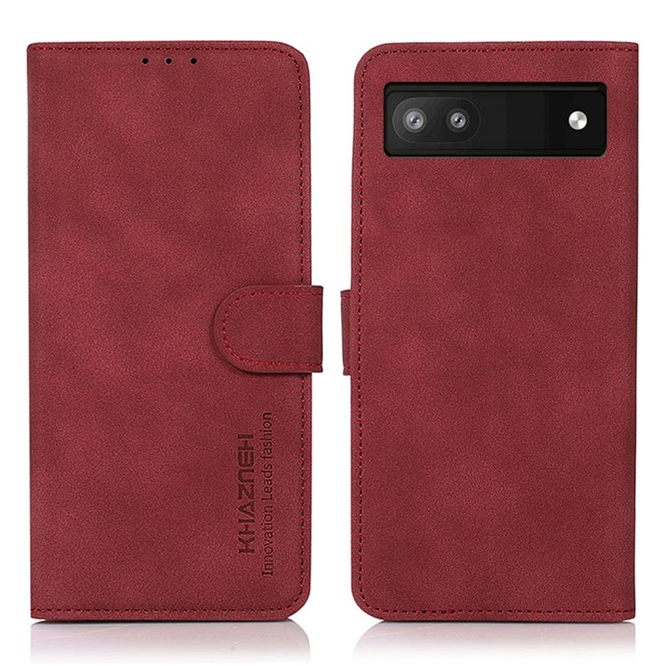 Matte red leather phone case with flip cover and holder strap; horizontal camera cutout.