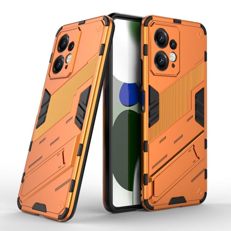 Orange rugged phone case with black accents and armored pattern for durable shock protection.