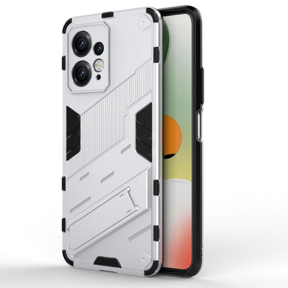 White rugged phone case with black accents and textured armor-style back for protection.