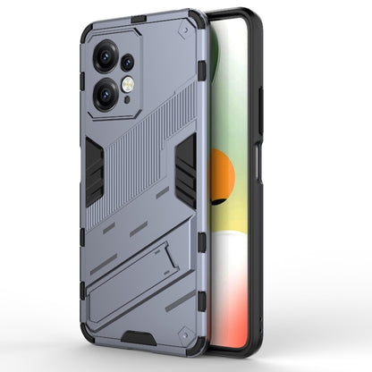 Grey rugged phone case with black accents and camera cutouts in an armor-style pattern.