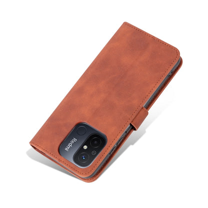 Brown flip leather phone case with diagonal stitching and camera cutout.