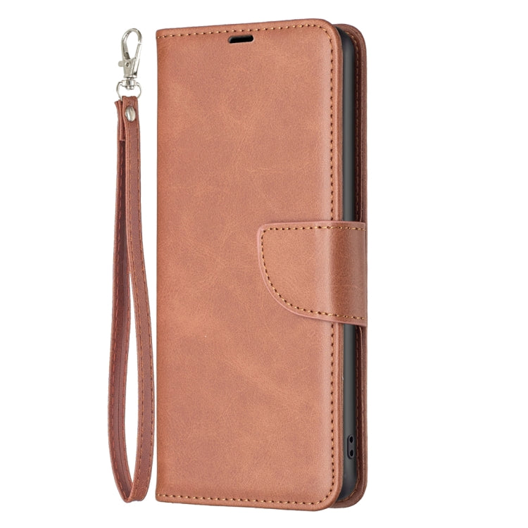 Brown folio phone case with wrist strap, stitched flap, and camera cutout.