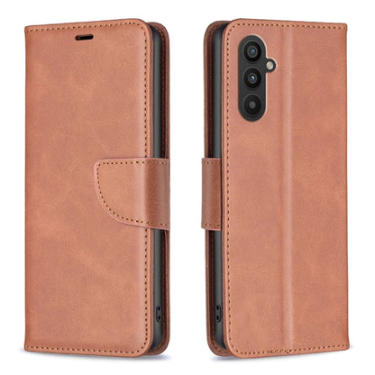 Tan/brown lambskin folio phone case with side strap and card holder; camera cutout